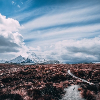 "The Long Road to Mordor print showcasing Scotland’s rugged landscape with a winding path leading into the distance under dramatic skies."